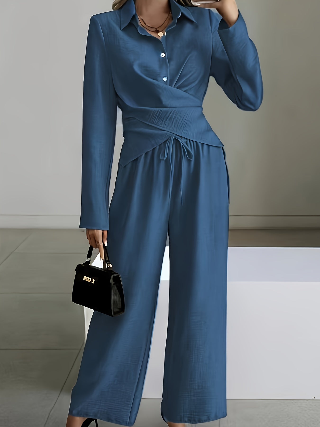 An Elegant And Minimalist Short Hem Top Paired with Wide-Leg Pants.